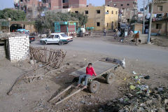 A child sits on a cart in Al Faiyum in Egypt
