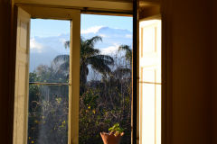 Mount Etna through the window of our house at new years eve in Sicily, Italy
