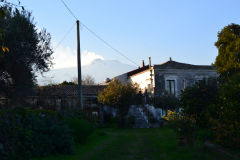 The smoking Mount Etna as seen from the garden of our house in Sicily, Italy