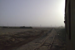 Desert landscape at the edge of the railway line between Al Faiyum and Al Wasta in Egypt.