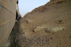 Desert landscape at the edge of the railway line between Al Faiyum and Al Wasta in Egypt.