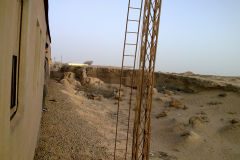 Desert landscape at the edge of the railway line between Al Faiyum and Al Wasta in Egypt.