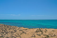 Quad driving at the coast of Coral Bay, Western Australia