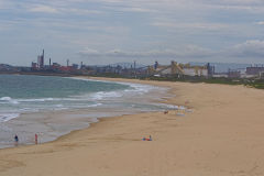 A beach with acoal fired power plant south of Wollongong, New South Wales, Australia