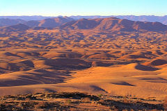 Desert landscape during sunset  at Valley of a Thousand Hills Campsite in Namibia