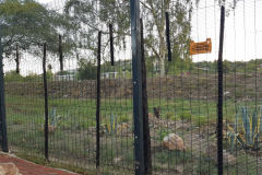 An electric fence and a security wall around the Urban City Camp Windhoek Namibia